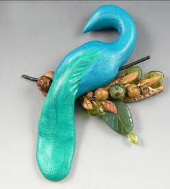 Clay peacock on a clay branch